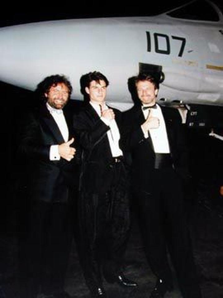 Don Simpson, Tom Cruise and Jerry Bruckheimer with a fighter plane from