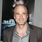 Elias Koteas به عنوان Monsieur Gateau