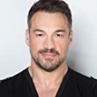 Aleks Paunovic به عنوان Detective Osgard