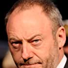 Liam Cunningham به عنوان Brick