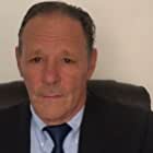 Chris Mulkey به عنوان John Cronan