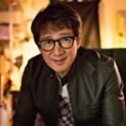 Ke Huy Quan به عنوان Waymond Wang