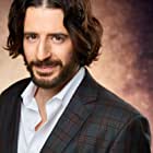 Jonathan Roumie به عنوان Party Guest