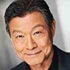 James Saito به عنوان Older Insurance Investigator