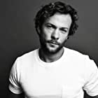 Kyle Schmid به عنوان Alex Caulder