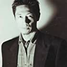 Liang Shi به عنوان Chinese Businessman (Mr. Chun)