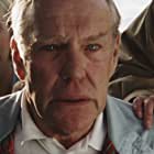 Harrison Young به عنوان Obsequious Executive