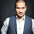 Jon Jon Briones به عنوان Hank