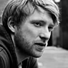 Domhnall Gleeson به عنوان Captain Andrew Henry