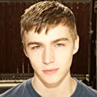 Miles Heizer به عنوان Alex Standall
