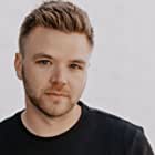 Brett Davern به عنوان Hubbie Whitlow