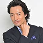 Yasuyuki Maekawa به عنوان Hidekatsu Henmi