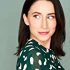 Courtney James Clark به عنوان Mosasaurus Announcer