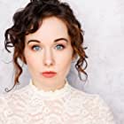 Anna Chazelle به عنوان Sarah (Pilot Casting Assistant)
