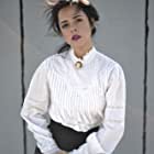 Emma Ramos به عنوان ED Resident Mariana