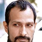 Mahesh Balraj به عنوان Ali Saeed