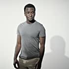 Alex Barima به عنوان David Logan