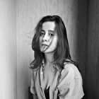 Sarah Hashmi به عنوان Divya Mehra